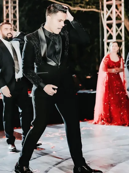 The groom's squad brings the energy with their own performance. I work with choreographers and entertainment teams to plan dynamic and fun dance numbers for the Sangeet.