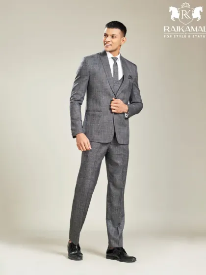 A classic three-piece suit never goes out of style. This shot showcases a perfectly tailored grey plaid suit, demonstrating my expertise in creating sharp, professional attire that is as fitting for a boardroom as it is for a formal event.