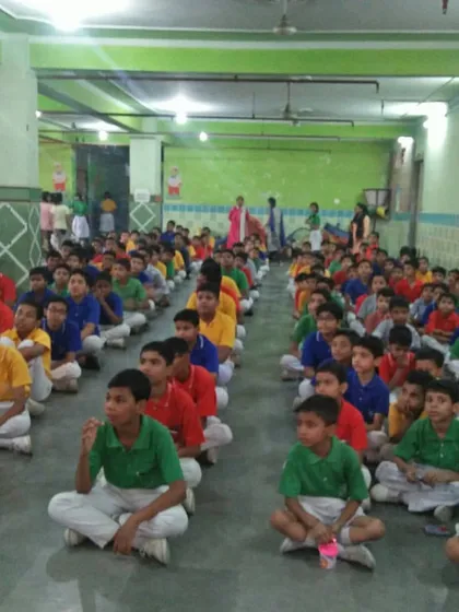 Rows of students sit attentively during a self-defense seminar. We teach them not only physical techniques but also the importance of awareness and focus.