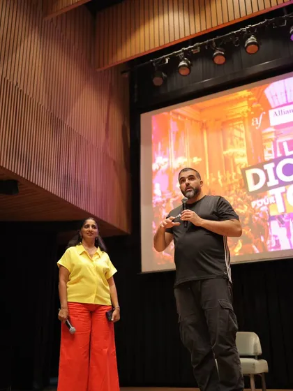 Abdellah Boudour, founder of La Dictée pour Tous, on stage with one of our directors, addressing the participants.