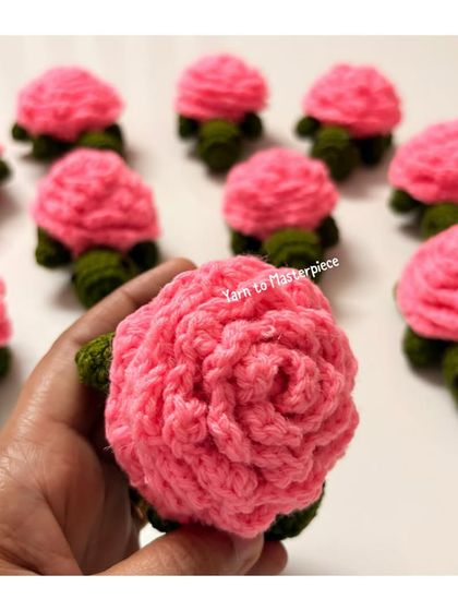 A close-up shot showing the texture and detail of the rose-petal shell on my turtle keychain. Each petal is crocheted to create a layered, 3D effect.