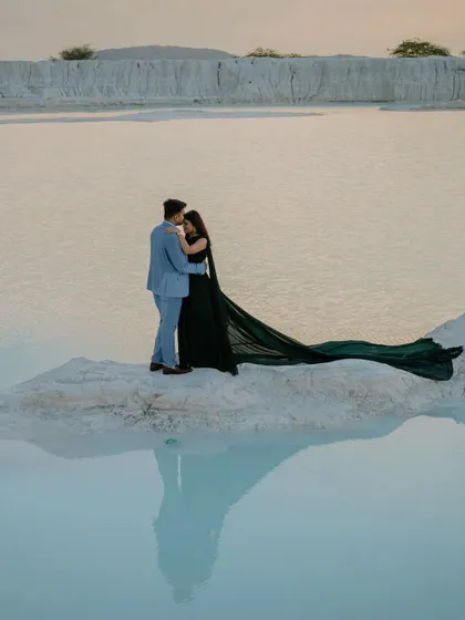 A romantic embrace on a small peninsula, with the couple's reflection creating a perfect mirror image. This is a great example of how I use the natural environment to create artistic shots.