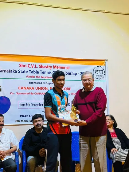 Aakash receiving his trophy for winning the Under 19 Boys title at the Shri C.V.L. Shastry Memorial Karnataka State Table Tennis Championship.