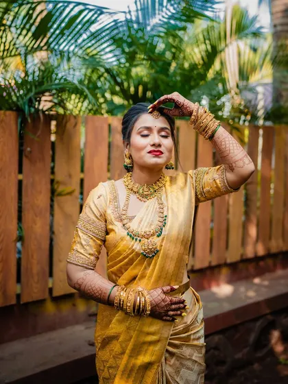 A candid moment of the bride, her eyes closed, showcasing the subtle yet beautiful eye makeup.