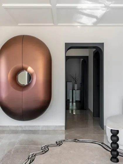Another view of the Evelyn lounge, with the statement bar unit as a central feature. The design of the room is a collection of unique, custom-made pieces that come together to create a cohesive and luxurious whole.