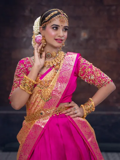 A high-definition South Indian engagement look I taught in my Probatch. The vibrant pink is perfect for celebrations.