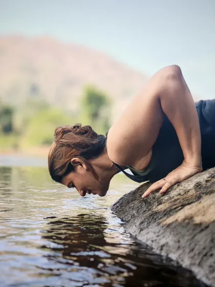 A moment of quiet reflection by the water during our trip to Athirapally Waterfalls. Nature is the ultimate reset button for the mind and soul.