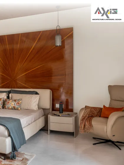 Craftsmanship is at the heart of my designs. This master bedroom features a magnificent radial wooden headboard that acts as a stunning centerpiece, radiating warmth and sophistication. It’s a personal sanctuary designed for rest and rejuvenation.