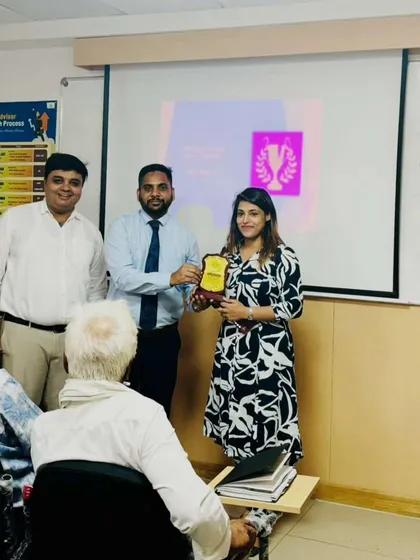 Being recognized for my hard work is always an honor. Here I am receiving an award for my performance, a moment that fuels my drive to continue delivering dedicated service and achieving results for my clients.