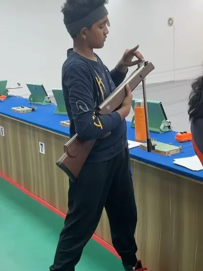 Day 1 of the Best Shot Open Shooting Competition 2024. A young shooter inspects his rifle, showing the focus and preparation that goes into every match.