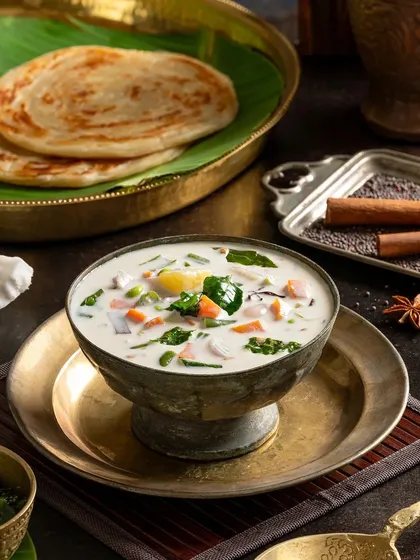 Kai Stew, a mild and creamy vegetable stew, perfectly paired with flaky parottas.