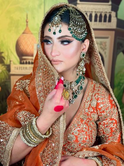 A side profile of our Pakistani bridal look. The winged liner and soft contouring are key features, along with the traditional jhoomar.