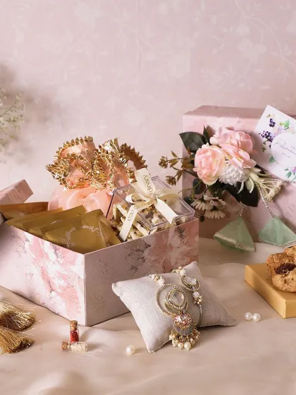 This Rakhi hamper is a gourmet twist on gifting, with fudge brownies, cranberry & pista chocolate barks, and NYC chunk cookies.