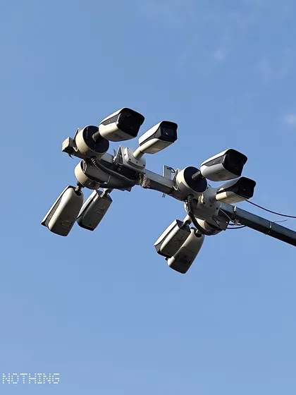 Another view of a multi-camera pole installation, designed for monitoring intersections or public spaces.