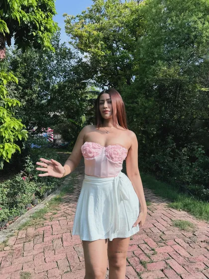A playful pose in the summery floral corset and skort.