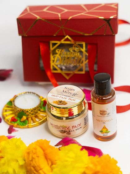 A compact and glowing Diwali gift set. This hamper includes a nourishing Mud Face Pack and Abhyanga oil, paired with a decorative diya for the festival of lights.