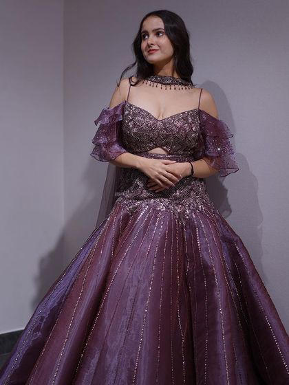 Step into the spotlight with my new arrival cocktail dresses, like this stunning purple gown with dramatic sleeves.