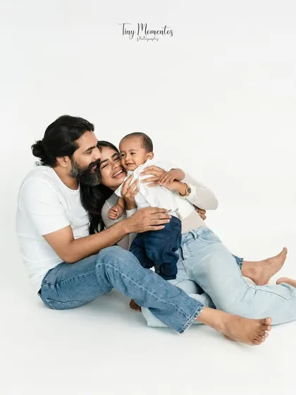 Wrapped in love. These quiet, candid family portraits on a clean white backdrop put all the focus on your family's unique connection.