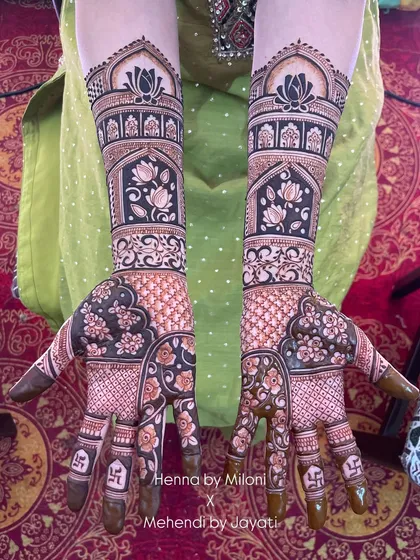 Matching mehendi for the groom's mother and sister. These designs are intricate and beautiful, perfect for the close family.