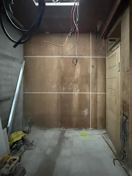 From concept to reality at 'Project LH.' This image shows a raw construction space marked out with guidelines, the first step in transforming an empty shell into a finished corporate interior.
