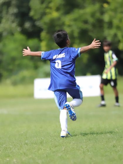 The pure joy of scoring a goal. Manas Raj celebrates with open arms after finding the back of the net.