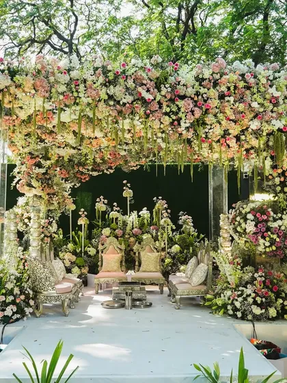 This mandap was a dream built from thousands of flowers. For this beachfront wedding, we designed a lush, cascading floral arch that felt both grand and intimately romantic, creating a breathtaking focal point for the ceremony.