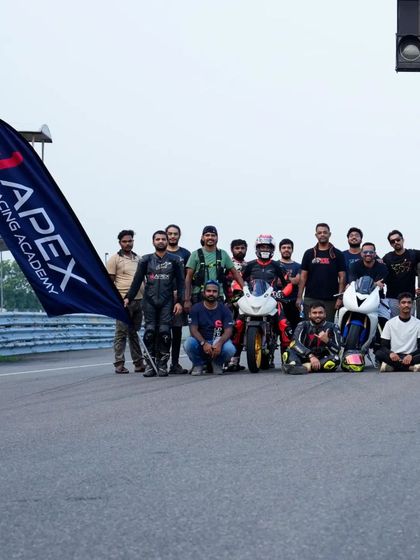 Our flag, our team. Another group of happy riders after a successful track event at the Madras International Circuit.