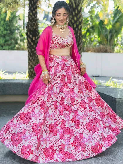 Another shot of the bride's twirl, showcasing the movement and fun of her floral outfit and romantic hairstyle.