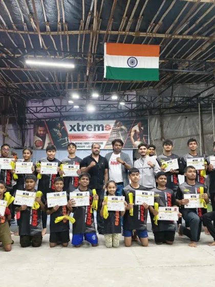 Celebrating our students' progress is a big part of our culture. Here, our young warriors proudly display their grading certificates after a successful evaluation, marking another step forward in their martial arts journey.