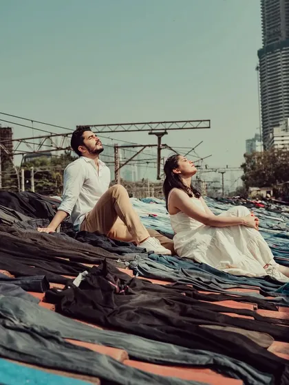 A unique pre-wedding shot of a couple relaxing on the rooftops of Dhobi Ghat. This image showcases our creative approach to capturing the unseen sides of Mumbai.