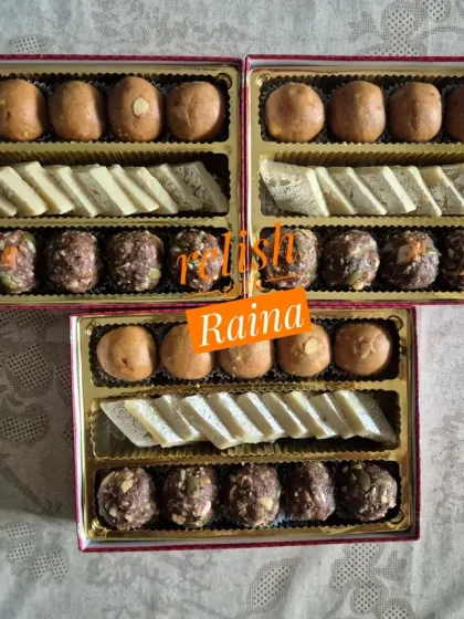 A top-down view of my assorted Rakhi sweet boxes. The combination of different colors and textures makes for a visually appealing gift.