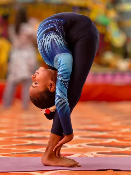 The Dimbasana is an advanced standing forward bend that requires incredible hamstring and spinal flexibility. True success comes from daily effort.