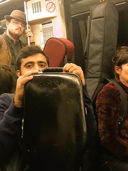 Our artists travelling on a train in Paris with their instruments. This image captures the reality of being a touring musician and our dedication to bringing our music to different stages.