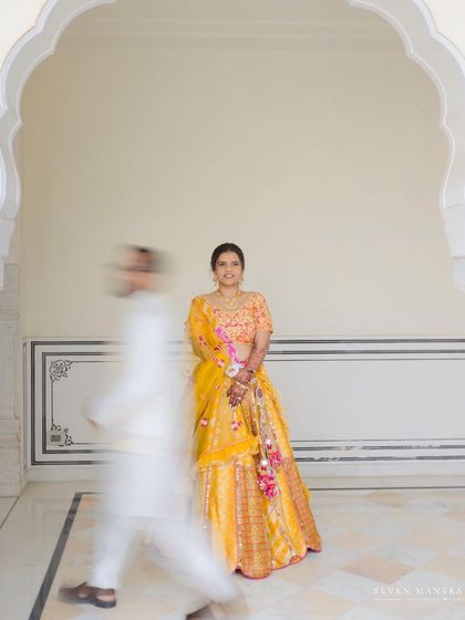 A creative use of motion blur to create an artistic and dynamic portrait. The bride is the still point in a fleeting moment.