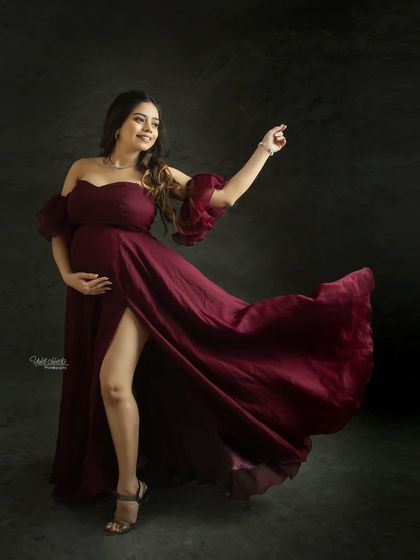 A joyful and dynamic pose in a beautiful flowing gown. This shot captures your vibrant personality and the happiness of this special time.