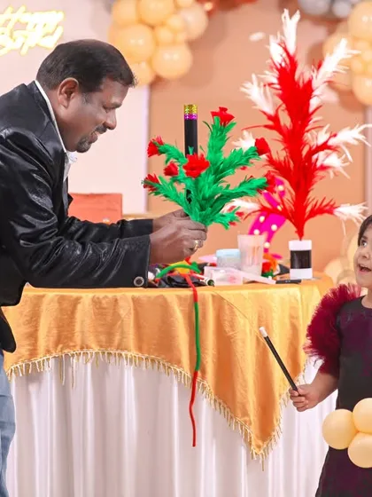 The look of pure wonder! We bring in top-notch entertainers, like this magician, to add an extra layer of magic to the party. Capturing a child's amazement during a magic show is one of our favorite parts of the job.