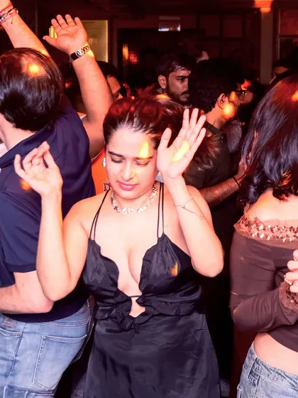 A guest lost in the music, feeling every beat of the old skool classics.