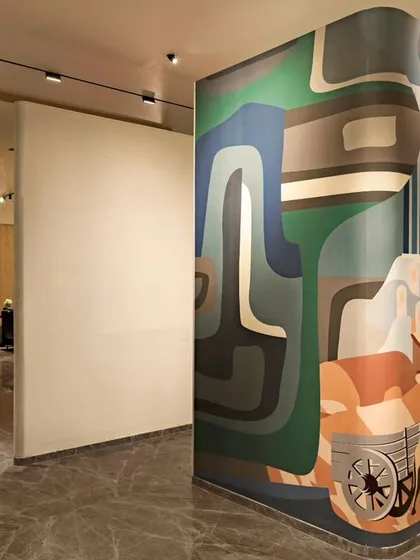 A custom mural for a corporate office in Nagaur, Rajasthan. The artwork blends modern abstract forms with colors and shapes inspired by the city and the company's connection to local farmers.
