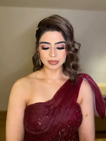 Jasleen's eyes closed to show the detail of the winged liner and blended eyeshadow.