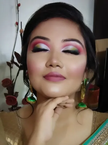 This shot shows the full artistry of the colorful eyeshadow, a perfect look for a themed party or festival.