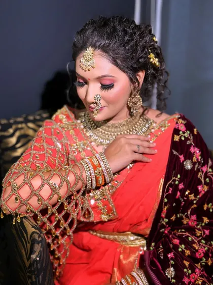 Another angle of the colorful bridal look, showing the intricate details of the blouse and the curly hairstyle.