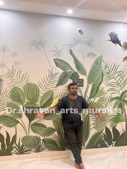 Here I am with the completed tropical mural. It was a great time working on this theme, which is one of my personal favorites.