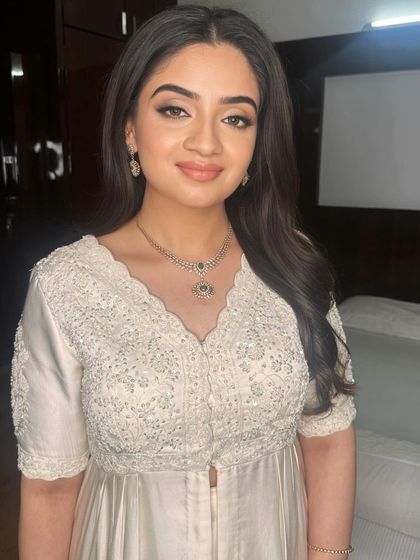 A beautiful client, Shravya, with a soft and ethereal look. Her eyes are gently defined and her skin is luminous.