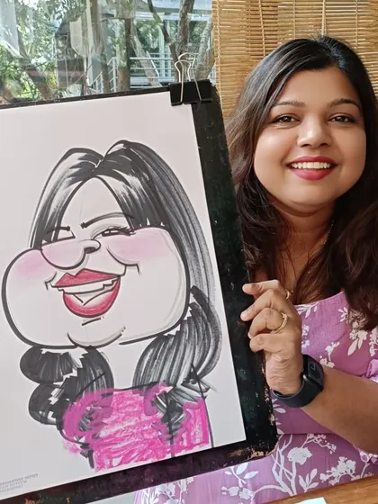 A smiling guest with her colorful caricature. It was a great way to ring in the new year.
