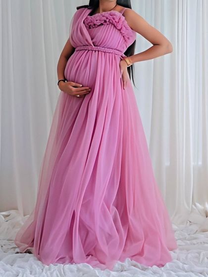 For a softer, more romantic look, I offer this lovely pink chiffon-style maternity gown. Its simple elegance is perfect for capturing the gentle moments of your pregnancy.