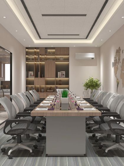 A conference room designed for a factory office, featuring a clean, professional look with a large meeting table and comfortable ergonomic chairs.