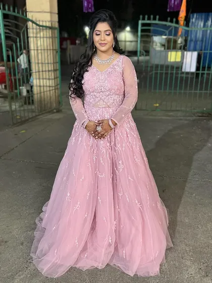 The full view of the bride-to-be in her beautiful pink engagement gown.