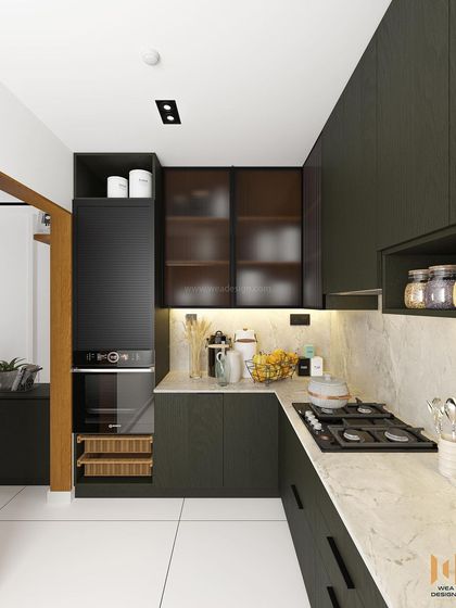 The kitchen for our Nano Home project, featuring a dark green laminate finish, black fluted glass cabinets, and a marble-textured quartz countertop.