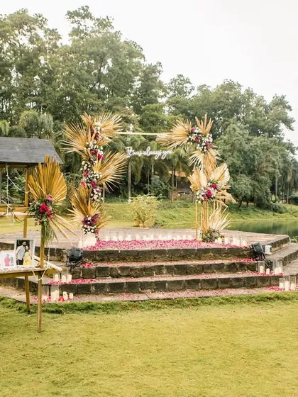 A charming wooden cart repurposed to display the couple's photos, adding a personal and nostalgic touch to the proposal decor.