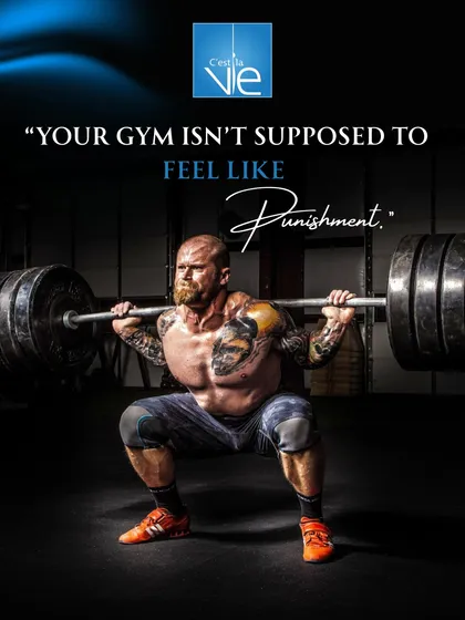 We believe your workout should be empowering, not a punishment. This powerful image of a member executing a heavy barbell squat embodies our philosophy of finding strength and joy in the challenge.